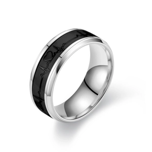 Detailed macro view of the heartbeat pattern on the luminous titanium steel heart ring