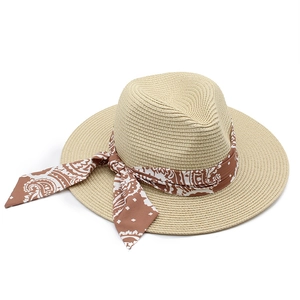 Light beige wide brim straw panama hat with brown paisley scarf ribbon for sun protection