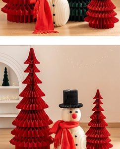 Close-up of honeycomb paper Christmas tree and snowman ornaments for holiday decor
