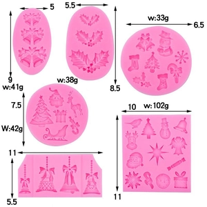 Pink silicone Christmas baking molds set featuring reindeer, trees and bells with dimensions