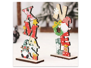 Close-up of wooden XMAS and NOEL letter signs with gnomes on a white fluffy surface