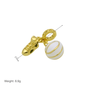 Macro shot of gold sneaker and globe charm pendant with zircon inlay and 27mm length detail