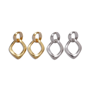 Minimalist geometric twisted gold and silver hoop earrings with zircon accents