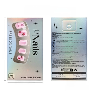 Detail of strawberry bow press-on nails set in laser box with tools and instructions