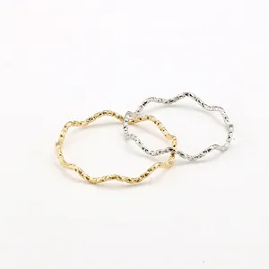 Minimalist wavy titanium steel rings in gold and silver with hammered texture finish