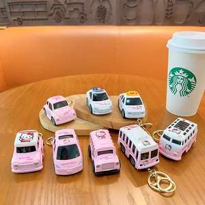Collection of miniature pink and white alloy pull-back car keychains and charms