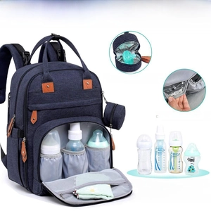 Detail of insulated pockets and removable pacifier bag for the waterproof diaper backpack