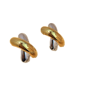 Polished gold and silver two-tone stainless steel drop earrings in a cross design