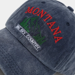 Close-up of vintage corduroy baseball cap with Montana mountain embroidery details