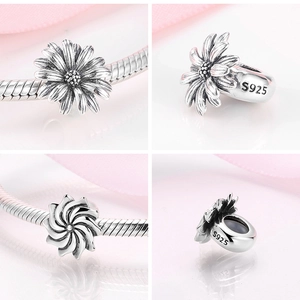 Macro views of S925 sterling silver daisy charm bead with hallmark details for bracelets