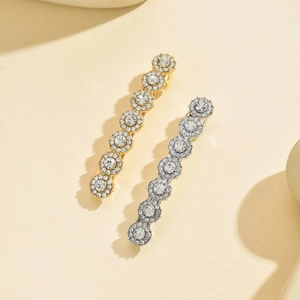 Elegant gold and silver sunflower hair clips with sparkling rhinestones set in metal