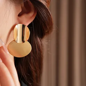 Minimalist brushed gold oval drop earrings for women with layered geometric design