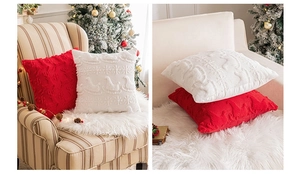 Detail of red and cream Christmas pillow covers with plush reindeer and snowflake textures