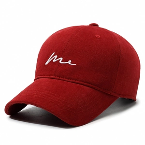 Deep red cotton baseball cap with white me letter embroidery in a classic curved brim style