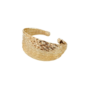 Minimalist gold multi-layer wavy open bracelet with metallic texture on white background