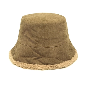 Close-up of khaki corduroy bucket hat with warm white fleece lining and soft brim detail