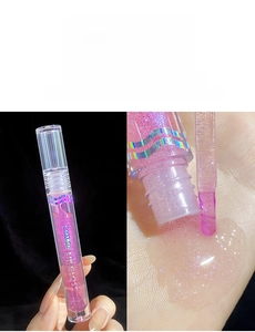Close-up of Light Oxygen Coral lip gloss 06 with purple pearlescent shimmer and shiny finish