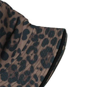 Detailed macro view of leopard print sun hat fabric texture and reinforced brim stitching