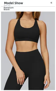 Detail of premium black yoga set featuring racerback sports bra and high-waist leggings