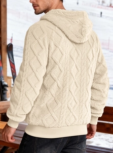 Detail of men's beige fleece hoodie featuring textured diamond pattern and ribbed cuffs