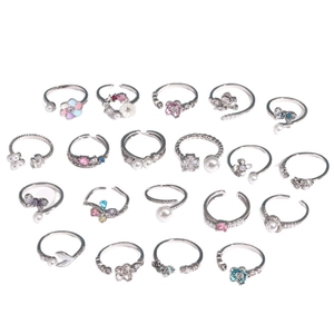 Set of 19 adjustable silver rings with enamel flowers butterflies and zircon stones