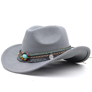 Detail of grey felt cowboy hat with ethnic woven band, beads, turquoise, and silver coin