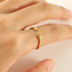 Minimalist 18K gold plated snake-shaped adjustable open ring shown on a hand