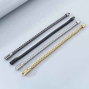 Detail of wheat chain bracelets in gold, silver, black and gunmetal stainless steel