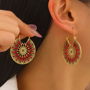 Vintage bohemian gold earrings with red silk thread and hollow sunburst floral patterns