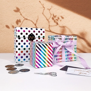 Rainbow polka dot and stripe gift wrapping paper set with ribbons and birthday cards