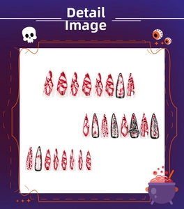 Detail of stiletto press on nails with Halloween blood splatter and gothic metal 3D charms
