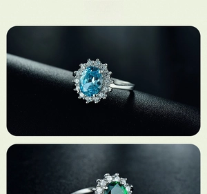 Detailed close-up of 925 sterling silver halo rings with blue and green oval zircons