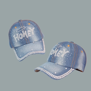 Blue denim baseball caps with HONEY rhinestone lettering and sparkling studded brim decor