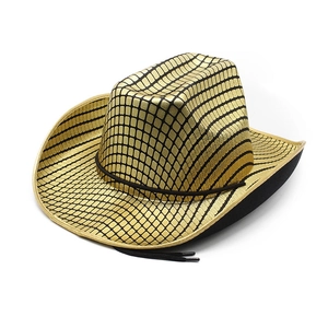 Detailed close-up of golden western cowboy hat with black grid pattern and trim cord