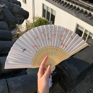 Detailed bamboo hand fan featuring ink-style peach blossom and bird with white tassel