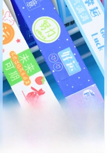 Detail of colorful printed ribbons showing cute cartoon patterns and Chinese characters