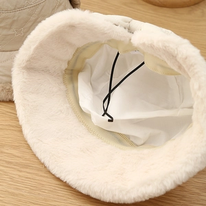 Detail of winter bucket hat with thick plush fleece lining and adjustable drawstring
