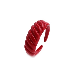 Fashionable bright red spiral enamel open ring with glossy finish on a white background