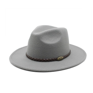 Close-up of a grey wool fedora hat featuring a brown woven band and antique metal buckle