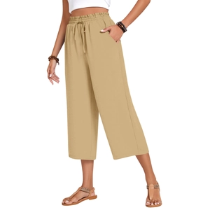 Detail of khaki linen wide-leg pants featuring elastic drawstring waist and side pockets