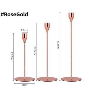 Three-piece rose gold taper candle holder set with heights of 22.5cm, 27.5cm, and 32.5cm