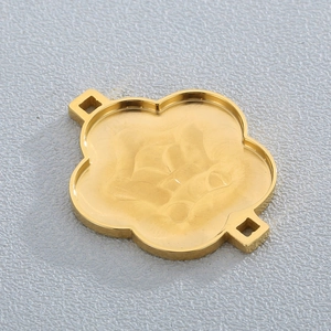 Detailed view of flower-shaped gold plated stainless steel pendant connector with dual loops
