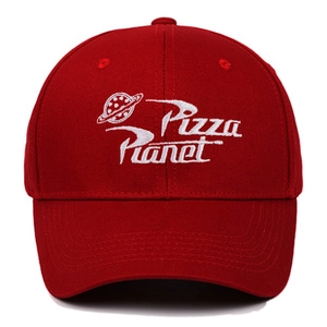 Detailed close-up of white Pizza Planet logo embroidery on a deep red washed baseball cap