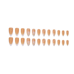 Almond fake nails with light orange french tips featuring white butterflies and pearls