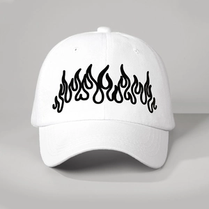 Detailed close-up of high-quality black flame embroidery on a white cotton baseball cap