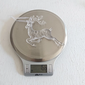 Detailed view of jumping deer Christmas pendant showing crystal acrylic texture and 16.6g weight