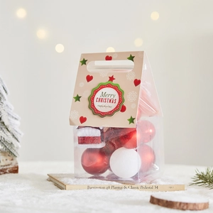 Red and white Christmas bauble set with mini house ornament in festive gift packaging