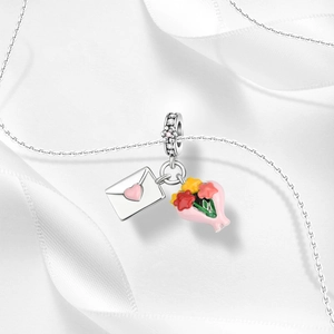 Detailed silver charm featuring a pink heart envelope and colorful enamel flower bouquet