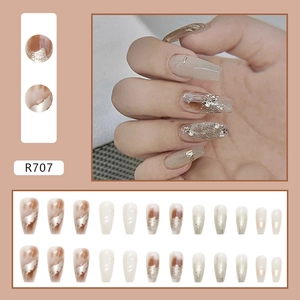 Silver glitter press-on nails with brown marble finish and gold foil accents