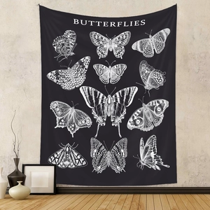 Detail of vintage black butterfly tapestry with white insect illustrations hanging on wall